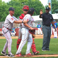 Greenville pitching coach Bob Kipper holds back RHP Devon Fisher, who had just been tossed by HP umpire Forrest Ladd after drilling Seuly Matias; Greenville @ Lexington; 5-13-2018