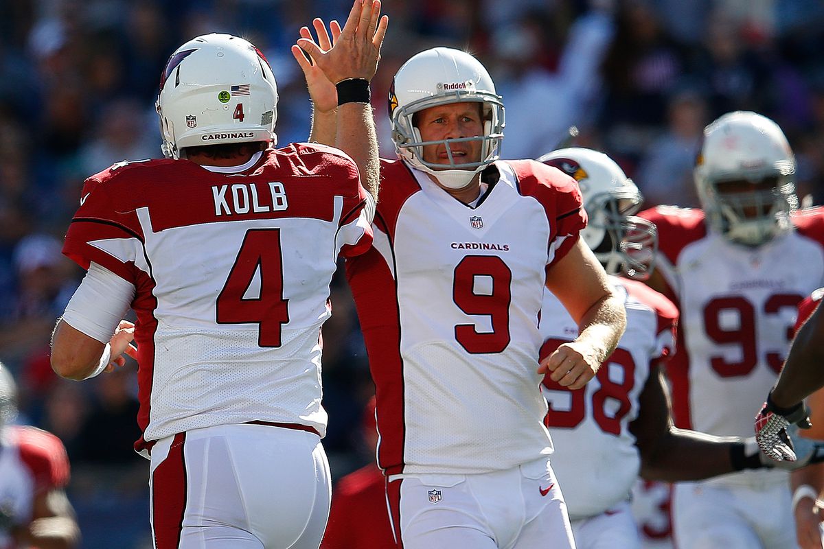 FOXBORO, MA - SEPTEMBER 16:   Dave Zastudil #9 of the Arizona Cardinals celebrate after  Kevin Kolb #4 scored a touchdown in the second half at Gillette Stadium on September 16, 2012 in Foxboro, Massachusetts. (Photo by Jim Rogash/Getty Images)