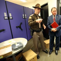 Utah Highway Patrol Lt. Jeff Nigbur shows Gov. Gary Herbert where they store evidence during a tour of the Utah Highway Patrol's  headquarters in Murray on Wednesday, Dec. 7, 2016.