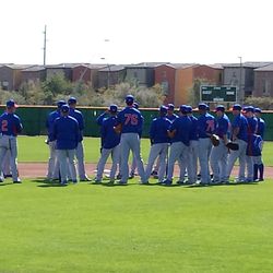 Team meeting to discuss the next drill. No. 76 is Kris Bryant - 