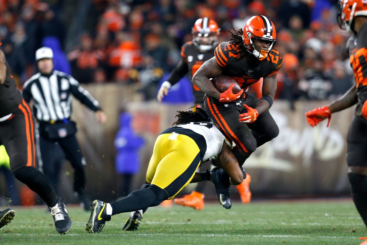 Kareem Hunt of the Cleveland Browns is tackled by Bud Dupree of the Pittsburgh Steelers during the fourth quarter at FirstEnergy Stadium on November 14, 2019 in Cleveland, Ohio.
