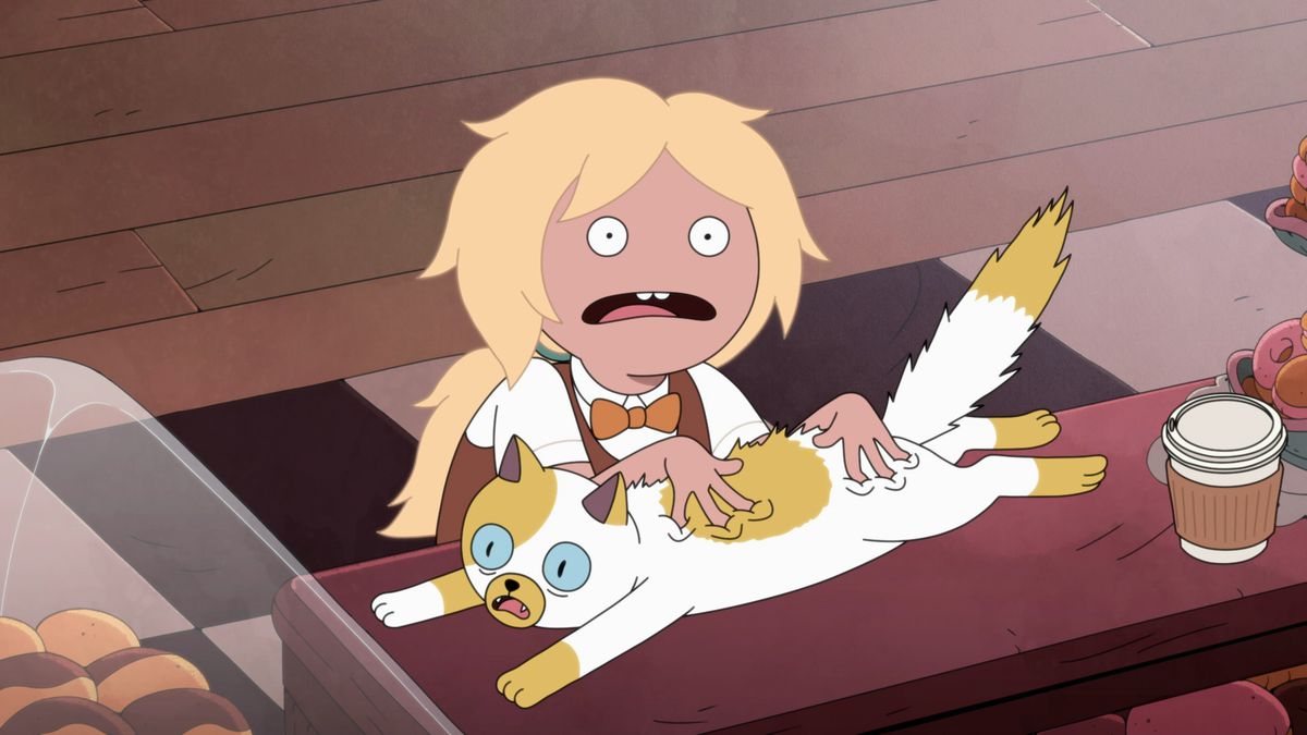 Fionna looking shocked as she presses her cat, Cake, into the counter of a bakery