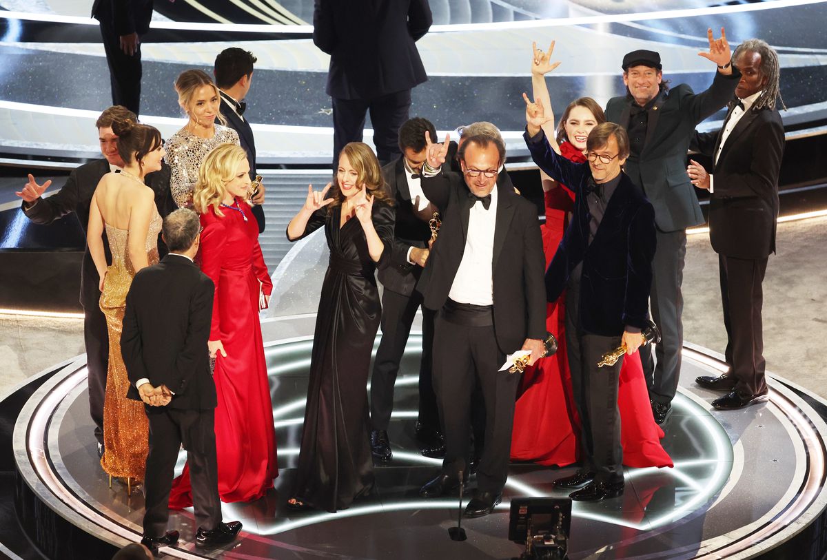 The cast and producers of CODA onstage after winning Best Picture at the 94 annual Oscars