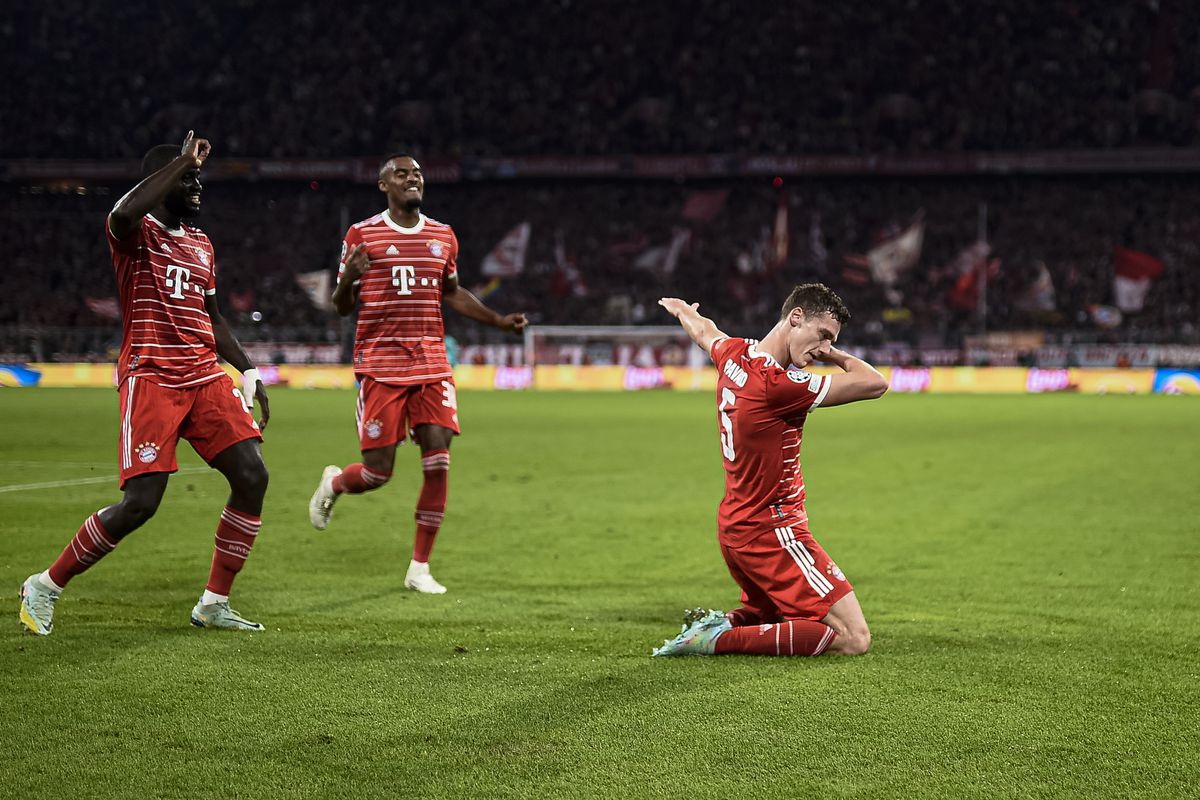 Benjamin Pavard (R) of FC Bayern Munich celebrates with...