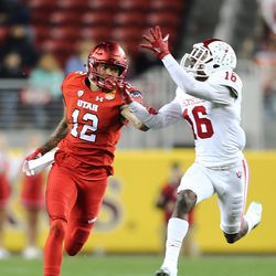 Indiana Hoosiers defensive back Rashard Fant (16) makes an interception ahead of Utah Utes wide receiver Tim Patrick (12) as the Utes and the Hoosiers play in the Foster Farms Bowl in Santa Clara, California on Wednesday, Dec. 28, 2016.