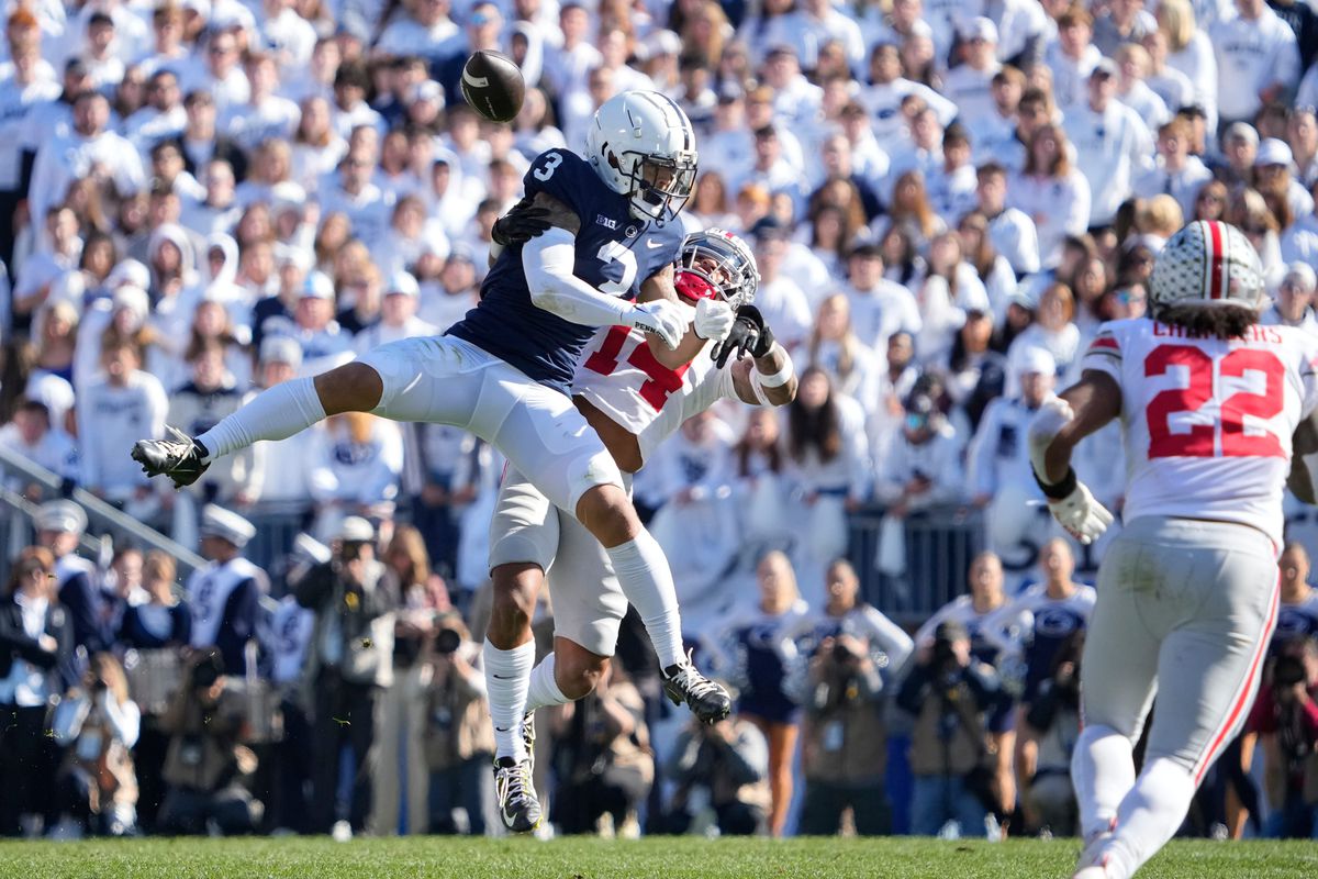 Ohio State Buckeyes safety Ronnie Hickman (14) breaks up a pass intended for Penn State Nittany Lions wide receiver Parker Washington (3) during the first half of the NCAA Division I football game at Beaver Stadium.