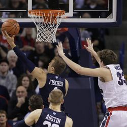 BYU's Chase Fischer (1) shoots against Gonzaga's Kyle Wiltjer (33) during the second half of an NCAA college basketball game, Thursday, Jan. 14, 2016, in Spokane, Wash. BYU won 69-68. (AP Photo/Young Kwak)