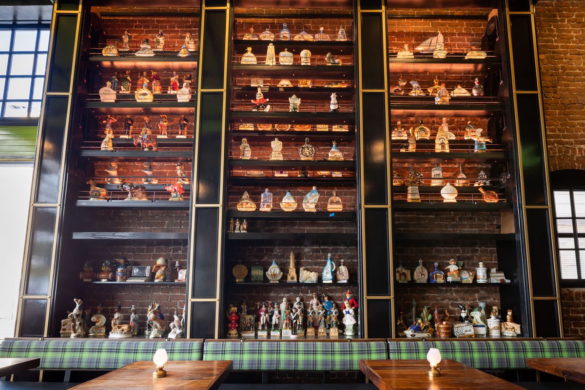 The shelves of decanters with gold accents.