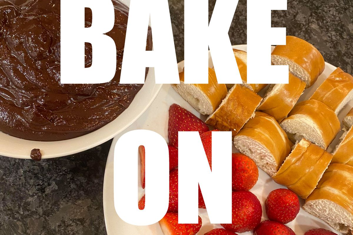 Text, “BAKE ON” in white block letters superimposed over a photo of sliced bread and strawberries on a plate next to a bowl of melted chocolate