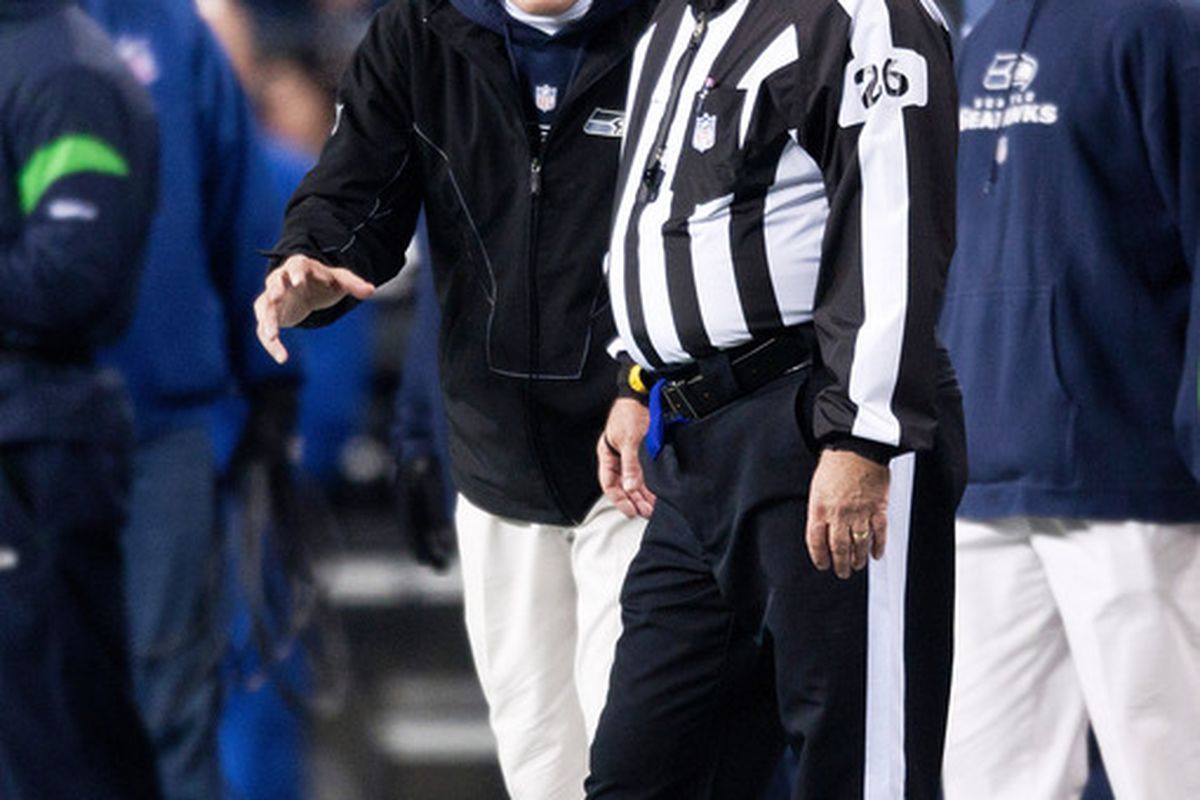 SEATTLE, WA - DECEMBER 1:  Pete Carroll of the Seattle Seahawks talks to head linesman Mark Baltz during a game against the Philadelphia Eagles at CenturyLink Field December 1, 2011 in Seattle, Washington. (Photo by Jay Drowns/Getty Images)