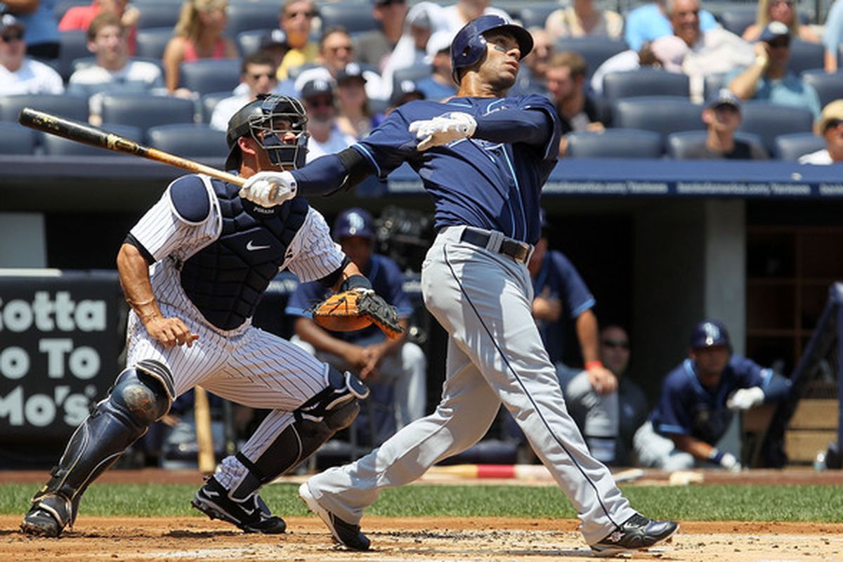 NEW YORK - JULY 18:  Carlos Pena #23 of the Tampa Bay Rays follows through on a first inning three run home run against the New York Yankees on July 18 2010 at Yankee Stadium in the Bronx borough of New York City.  (Photo by Jim McIsaac/Getty Images)