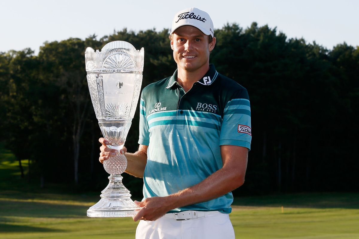 FARMINGDALE, NY - AUGUST 26:  Nick Watney celebrates with the trophy after his three-stroke victory at The Barclays at the Black Course at Bethpage State Park August 26, 2012 in Farmingdale, New York.  (Photo by Scott Halleran/Getty Images)