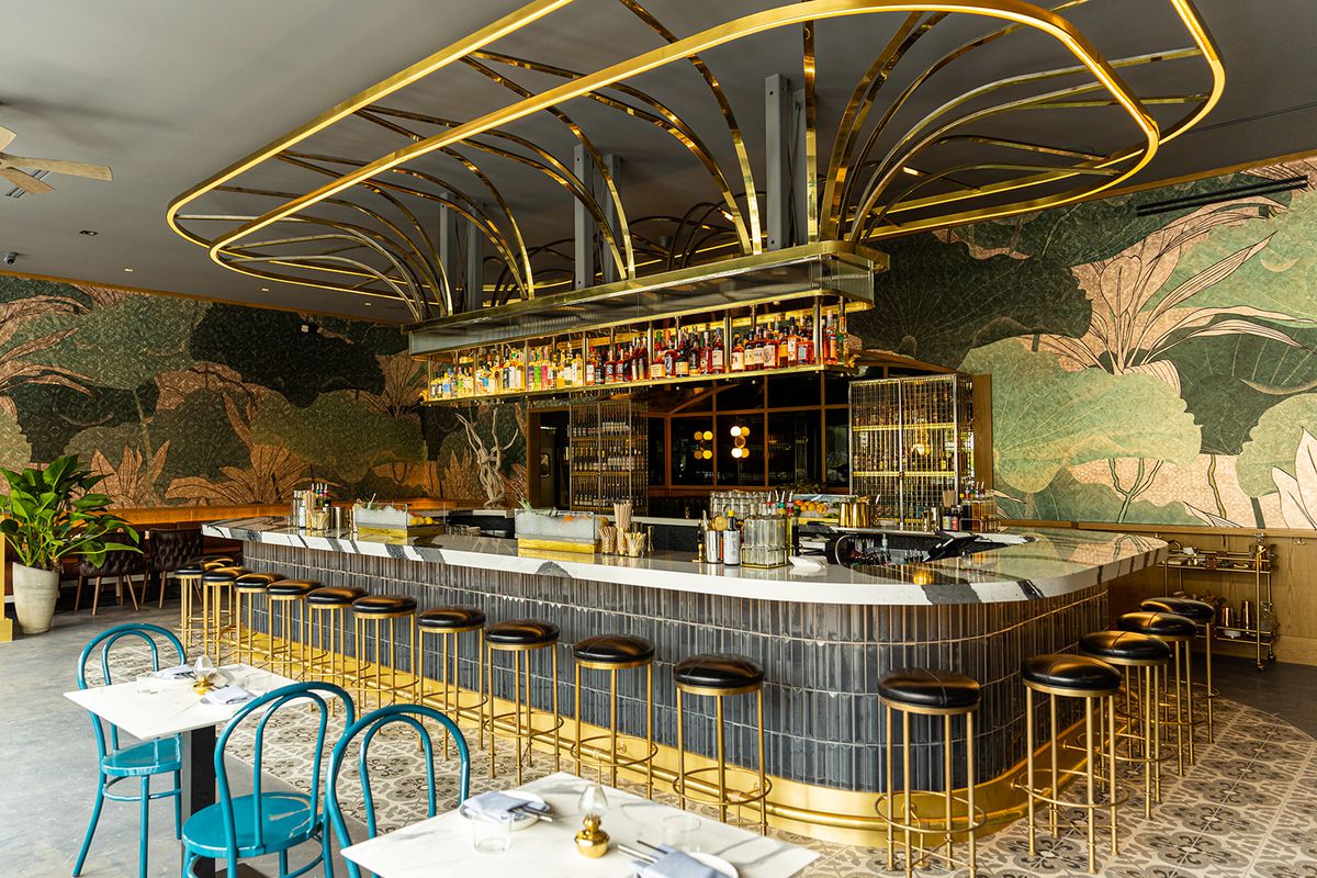A big gold cocktail bar at a restaurant.