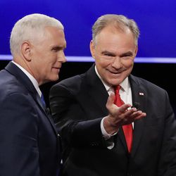 Republican vice-presidential nominee Gov. Mike Pence and Democratic vice-presidential nominee Sen. Tim Kaine walk off the stage after the vice-presidential debate at Longwood University in Farmville, Va., Tuesday, Oct. 4, 2016. (AP Photo/David Goldman)