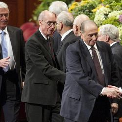 The First Presidency walks off the stand shaking hands with the Twelve after the afternoon session Saturday, April 6, 2013 of the 183th Annual General Conference of The Church of Jesus Christ of Latter-day Saints in the Conference Center.