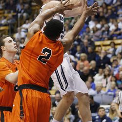 Brigham Young Cougars guard Skyler Halford (23) drives by Pacific Tigers guard T.J. Wallace (2) at the Marriott Center Saturday, Feb. 14, 2015. BYU beat the Tigers, 84-59.