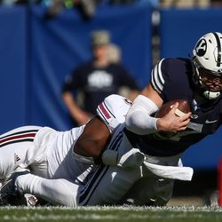 Brigham Young Cougars quarterback Taysom Hill (7) runs for first down during a game against the UMass Minutemen at LaVell Edwards Stadium in Provo on Saturday, Nov. 19, 2016.