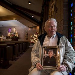 Pat King, holding a photograph of his late mother, Geraldine King, poses for a photograph at Saint Vincent dePaul Parish in Holladay on Thursday, Dec. 22, 2016. King's mother attended the Catholic Church nearly every day for 20 years until she passed away in April of 2016. Recently, King announced a $4 million donation in honor of his mother to fund a homeless resource center in Salt Lake City.