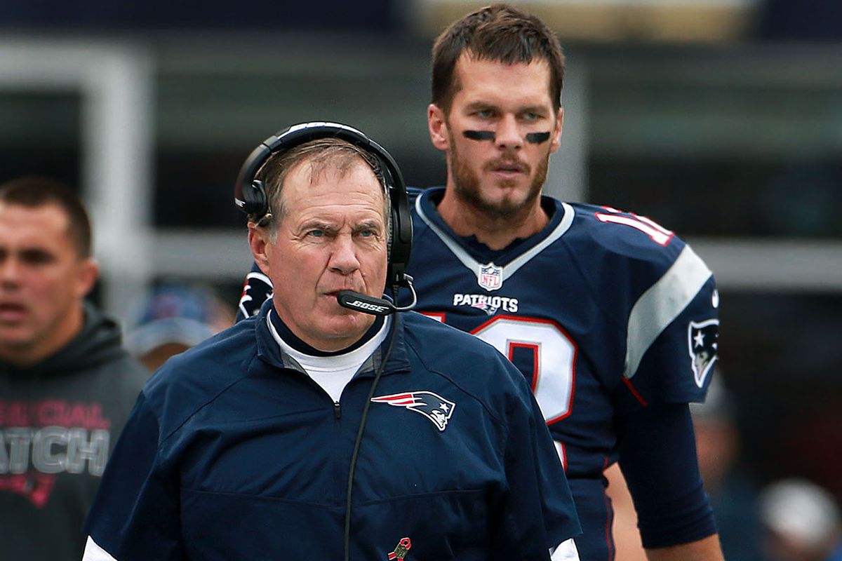 New England Patriots quarterback Tom Brady and head coach Bill Belichick are pictured on the sidelines during an NFL football game against the New York Jets at Gillette Stadium.