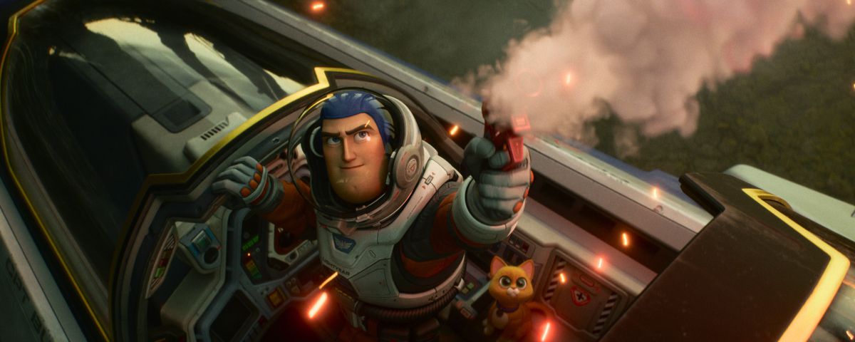 Buzz Lightyear and his robot cat Sox stand in the cockpit of an X-wing-like ship in Lightyear