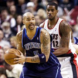 Jazz forward Carlos Boozer, left, had 22 points and 23 rebounds against the Blazers.
