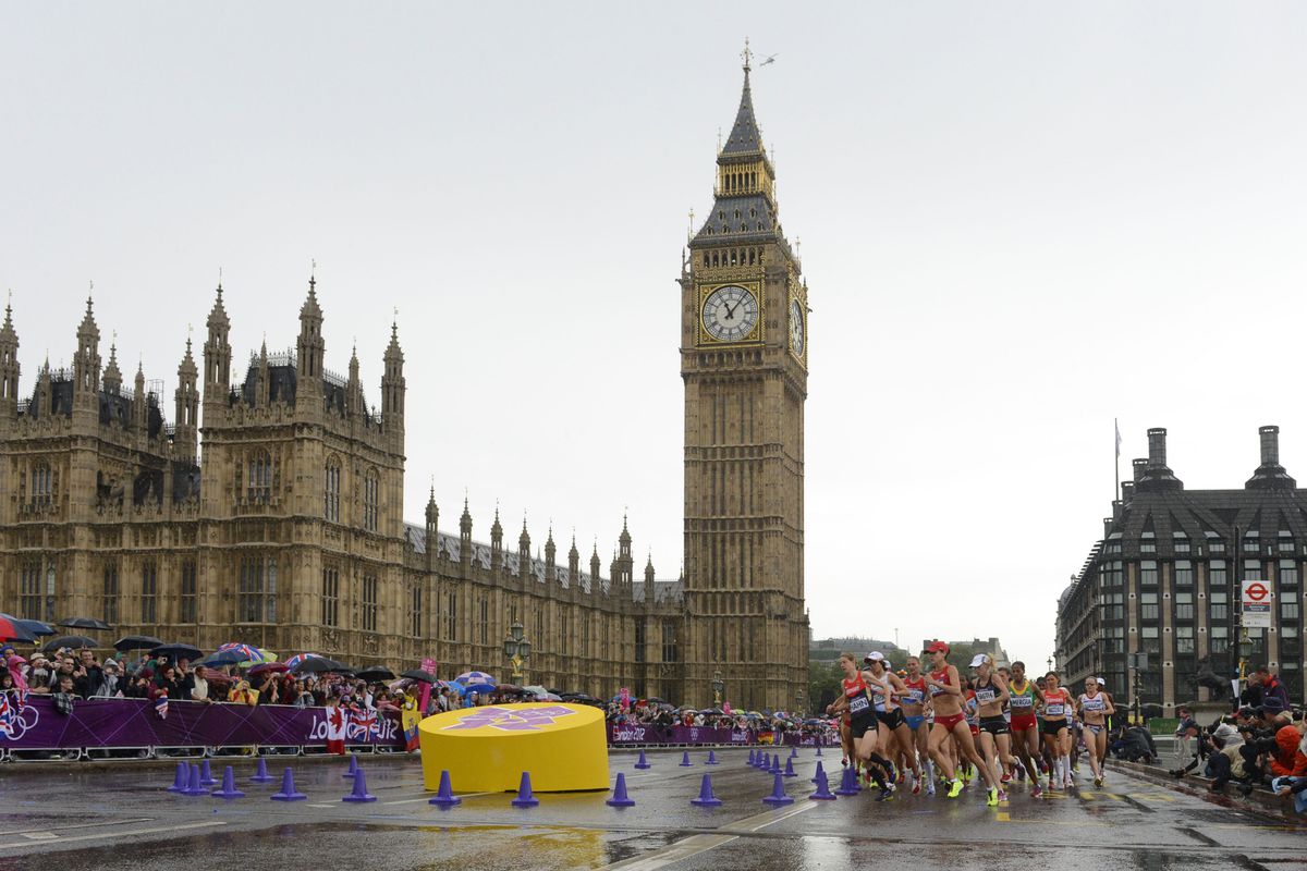 Aug 5, 2012; London, United Kingdom; The marathon runners on the course with Big Ben in the background during the London 2012 Olympic Games at The Mall. Mandatory Credit: Bob Donnan-USA TODAY Sports