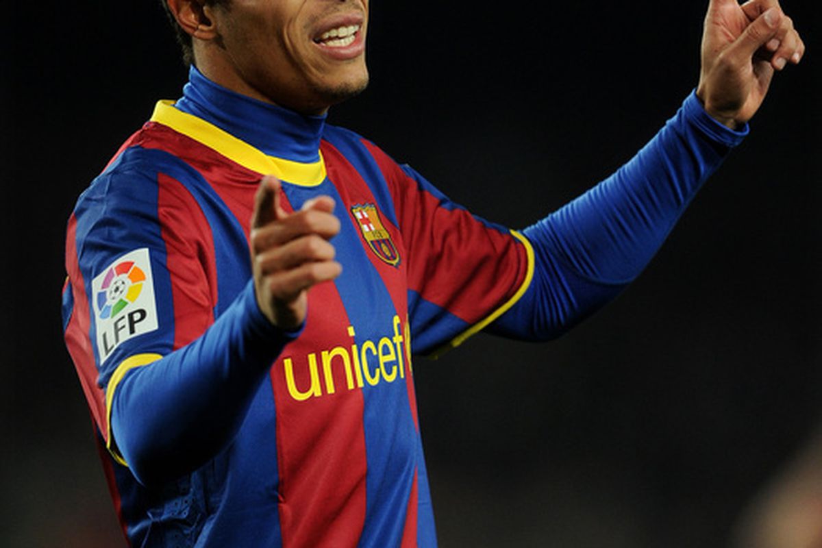 BARCELONA SPAIN - JANUARY 22:  Adriano of Barcelona gestures during the la liga match between Barcelona and Racing Santander at the Camp Nou stadium on January 22 2011 in Barcelona Spain.  (Photo by Jasper Juinen/Getty Images)