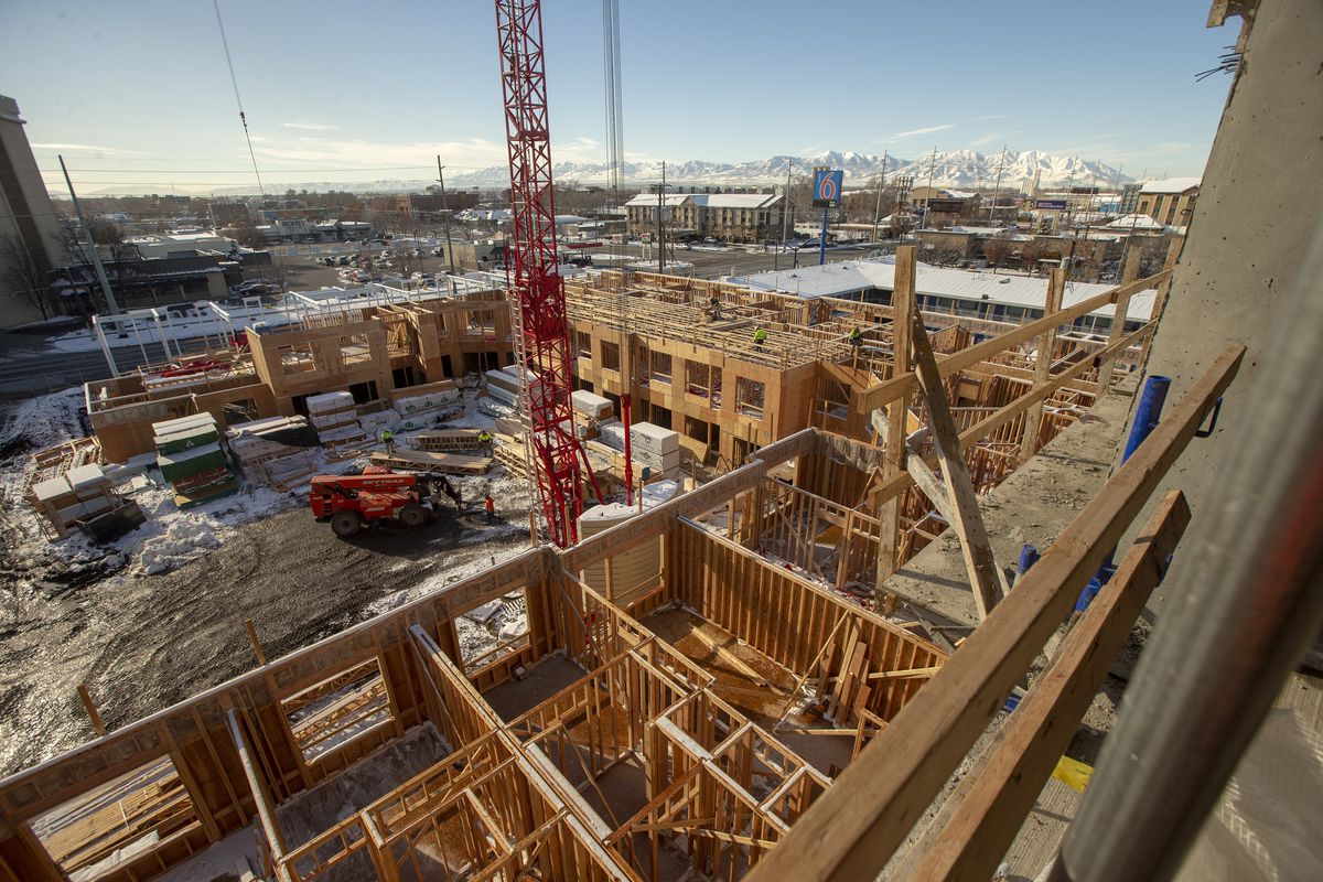 Construction workers work at the Garden Lofts, an affordable housing project being built in Salt Lake City, on Friday, Dec. 28, 2018.
