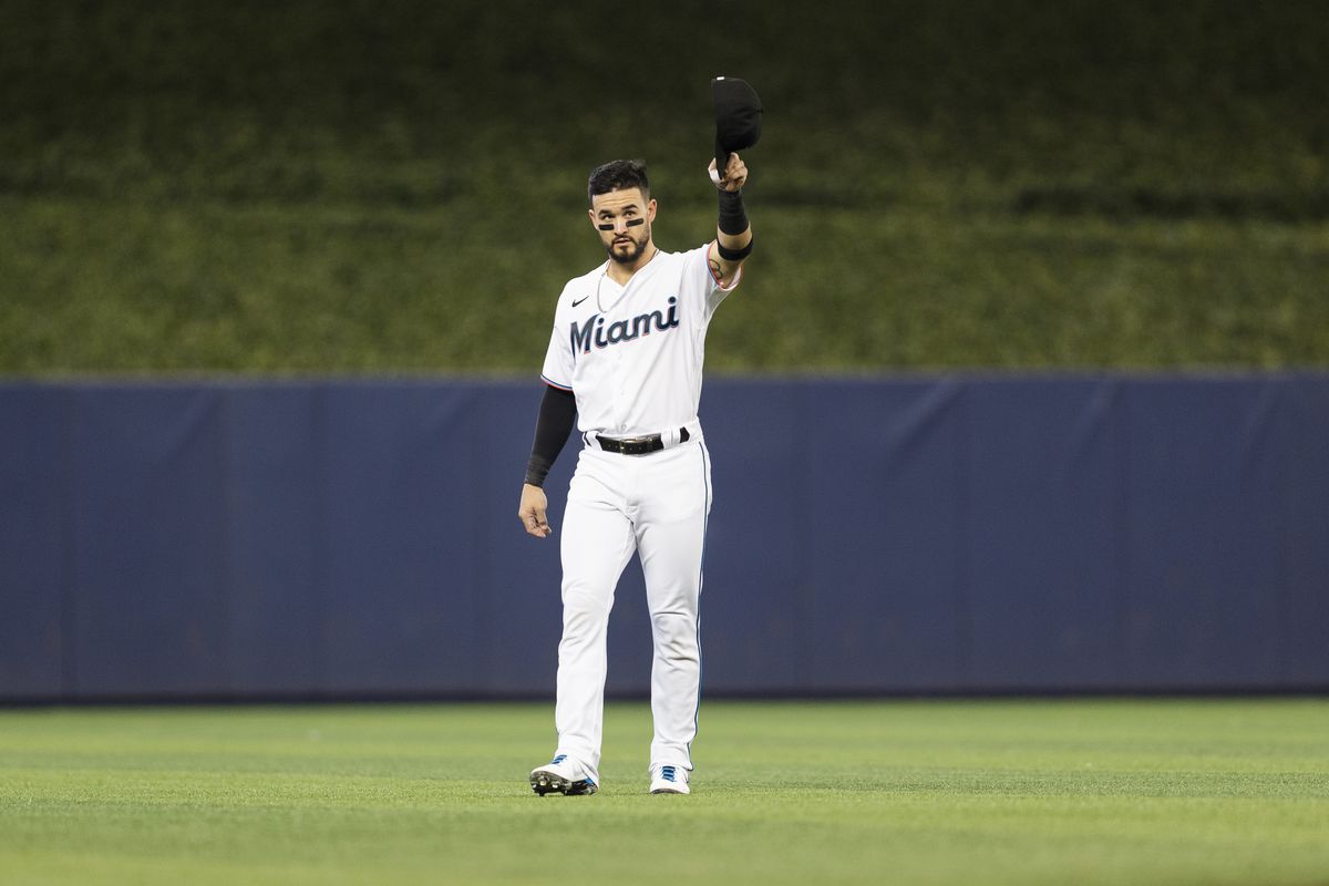 Eddy Alvarez #65 of the Miami Marlins salutes fans before the start of the game against the Pittsburgh Pirates at loanDepot park