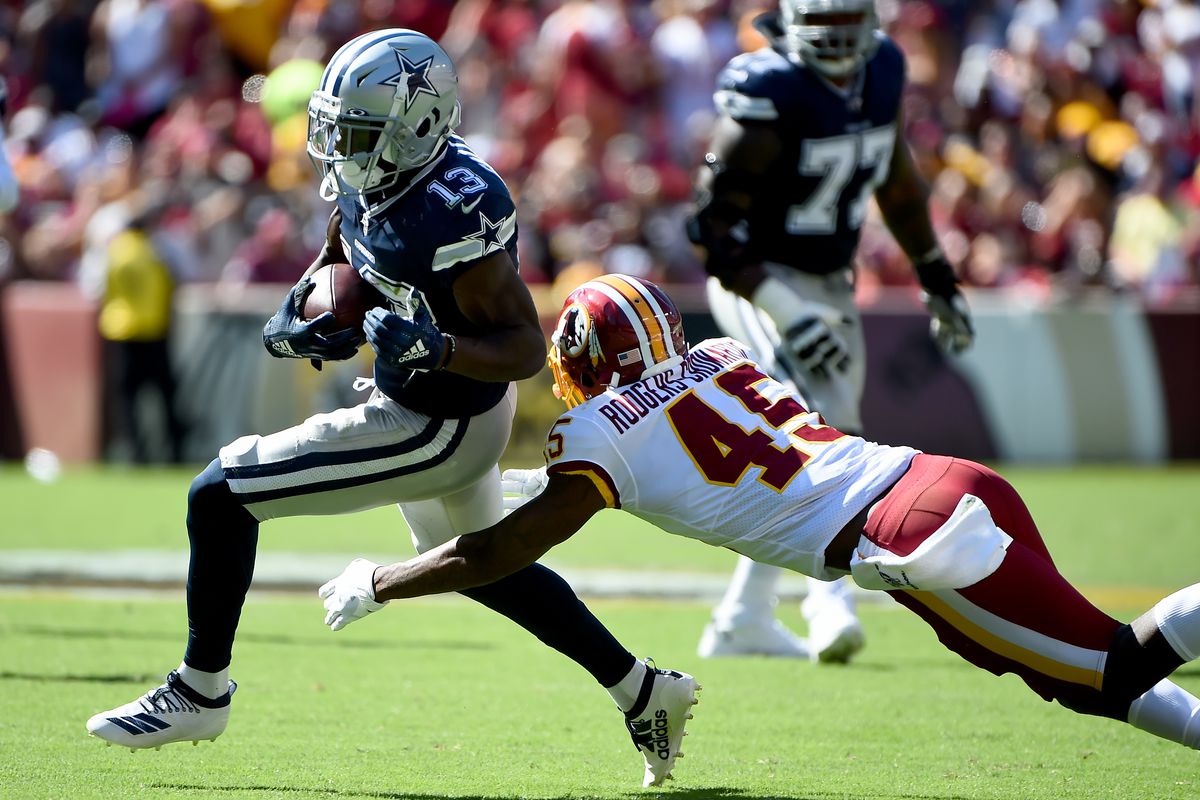 Michael Gallup of the Dallas Cowboys runs in front of Dominique Rodgers-Cromartie during the second half at FedExField on September 15, 2019 in Landover, Maryland.