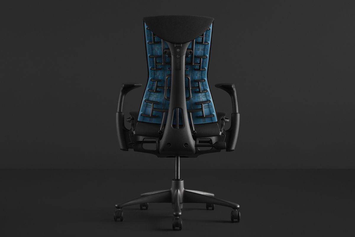 An Embody Gaming Chair, in black, with a bright blue support on the back.