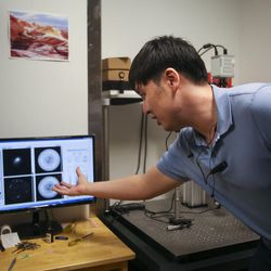 University of Utah electrical and computer engineering doctoral student Ganghun Kim shows off images of interior brain cells in his lab in the Sorenson Molecular Biotechnology Building on the U. campus in Salt Lake City on Tuesday, March 21, 2017.
