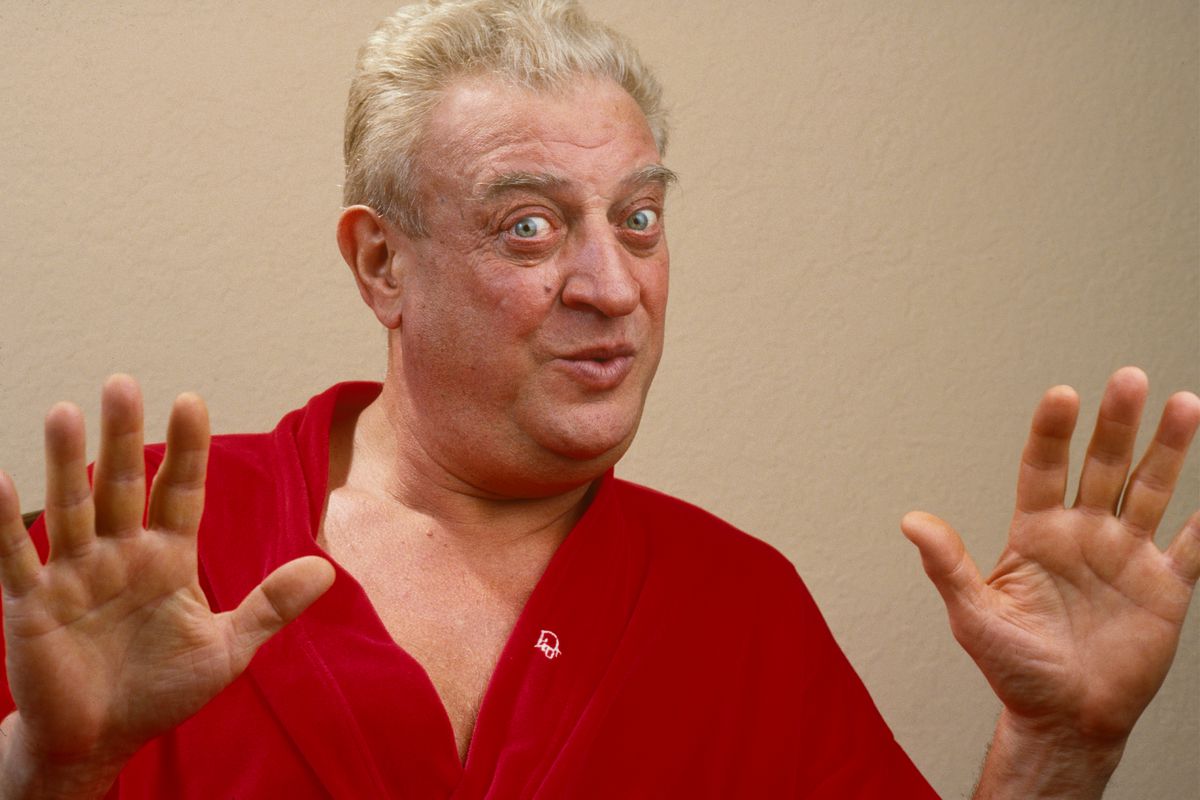 Rodney Dangerfield holding up his hands and looking askance.