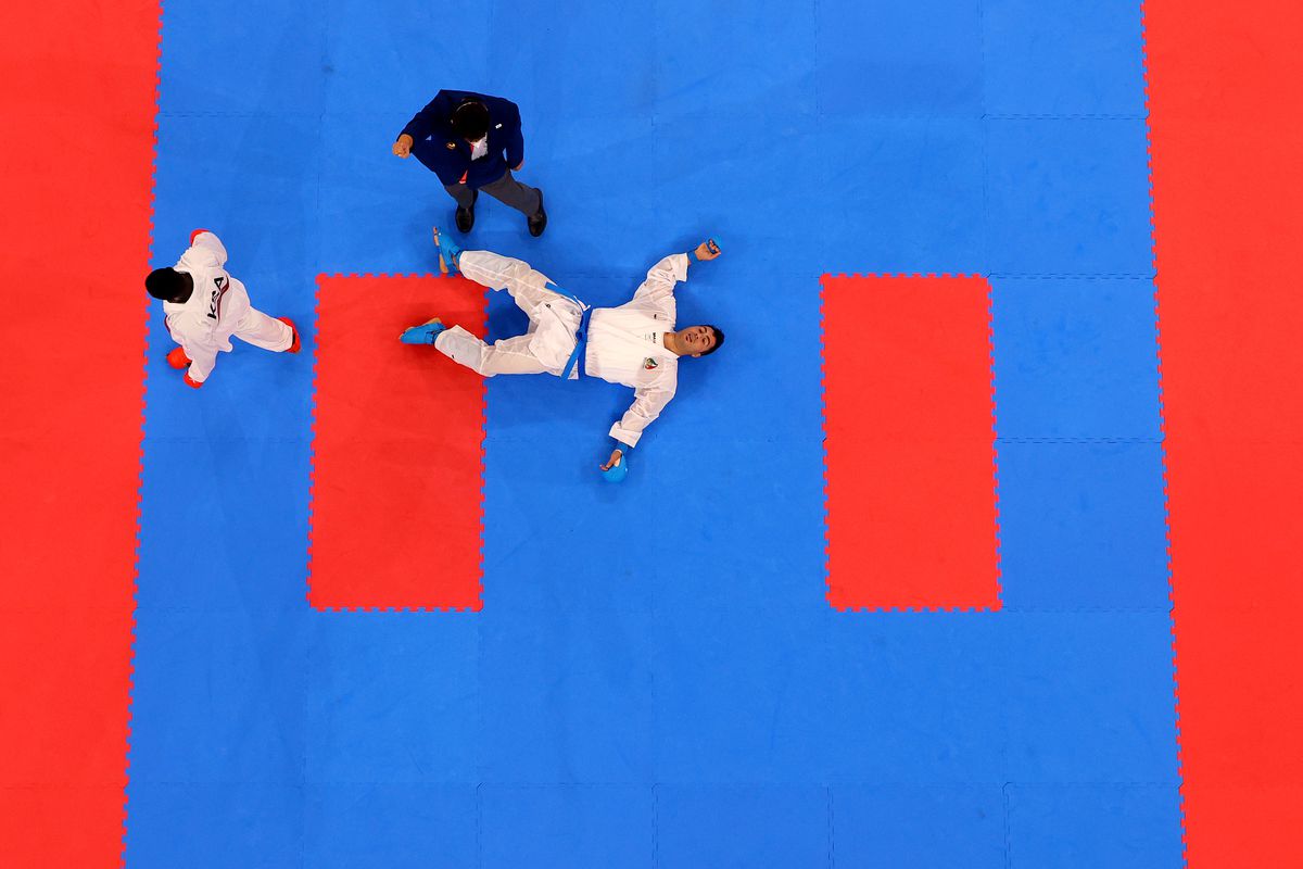 Sajad Ganjzadeh (R) of Team Iran lays on the tatami after being struck by Tareg Hamedi of Team Saudi Arabia during the Men’s Karate Kumite +75kg Gold Medal Bout on day fifteen of the Tokyo 2020 Olympic Games at Nippon Budokan on August 07, 2021 in Tokyo, Japan.