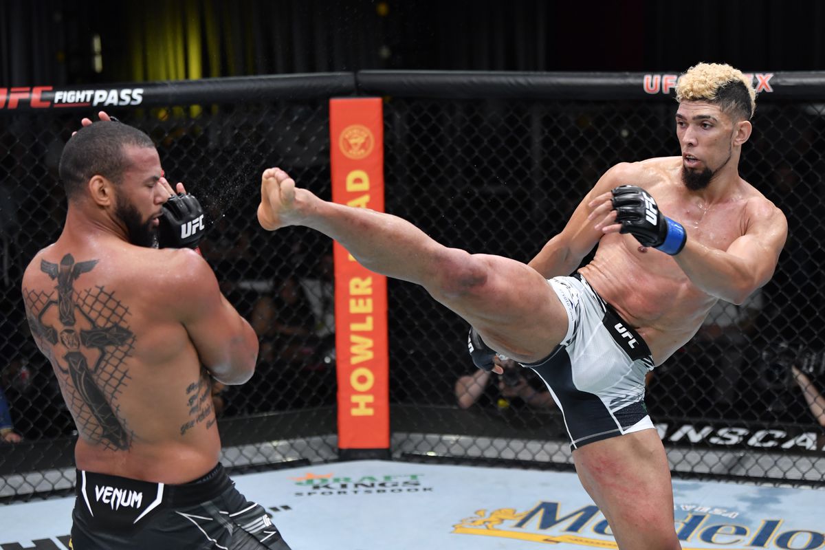 &nbsp;In this handout photo provided by UFC, (R-L) Johnny Walker of Brazil kicks Thiago Santos of Brazil in their light heavyweight bout during the UFC Fight Night event at UFC APEX on October 02, 2021 in Las Vegas, Nevada.