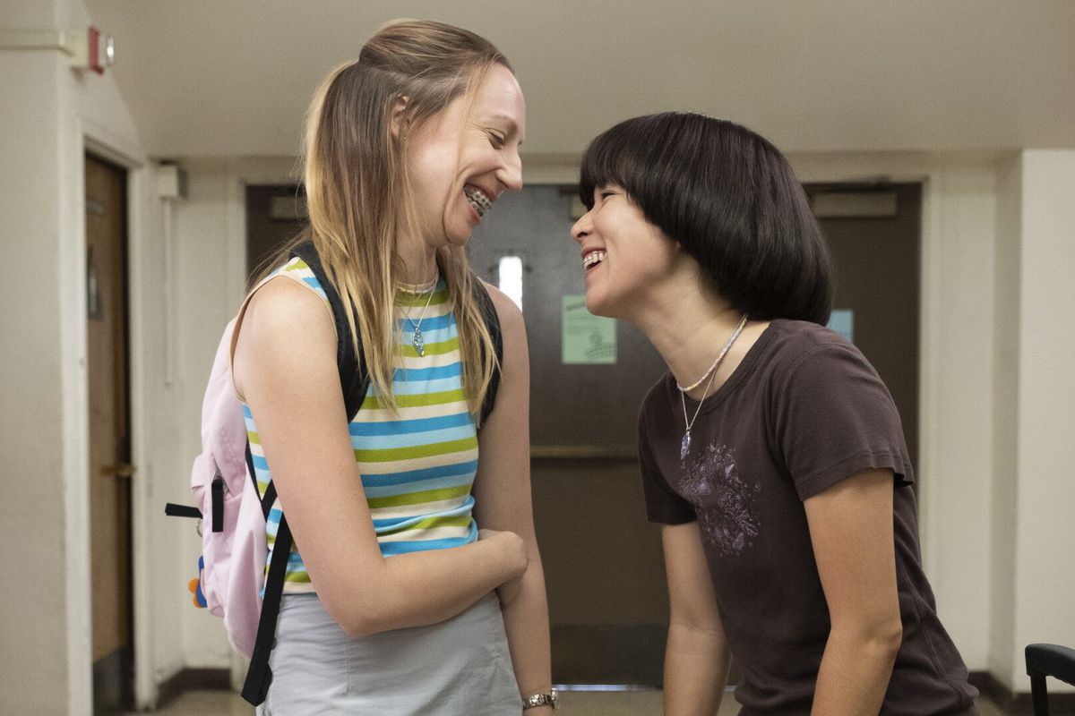 Anna (left) and Maya smiling at each other in a scene on PEN15