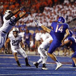 Justin Blackmore of the Brigham Young Cougars pressures punter Trevor Harman of the Boise State Broncos during NCAA football in Boise, Thursday, Sept. 20, 2012. 