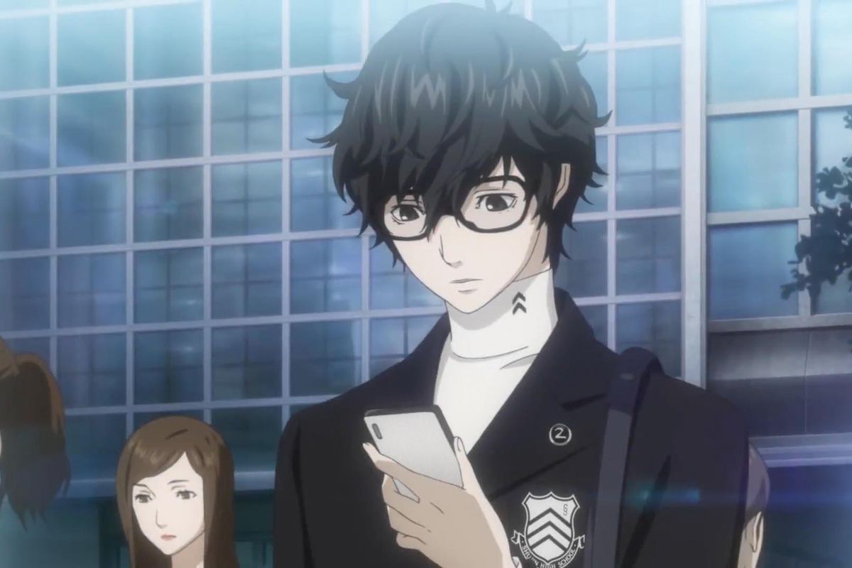 the main character looks at a cell phone in persona