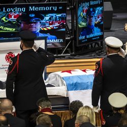 Chicago Fire Department personnel pay their respects before the start of the funeral for firefighter MaShawn Plummer at the House of Hope church on the Far South Side, Thursday morning, Jan. 6, 2022.