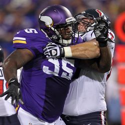 Aug 9, 2013; Minneapolis, MN, USA; Minnesota Vikings defensive tackle Sharrif Floyd (95) is blocked by Houston Texans guard Cody White (67) during the second quarter at the Metrodome. 