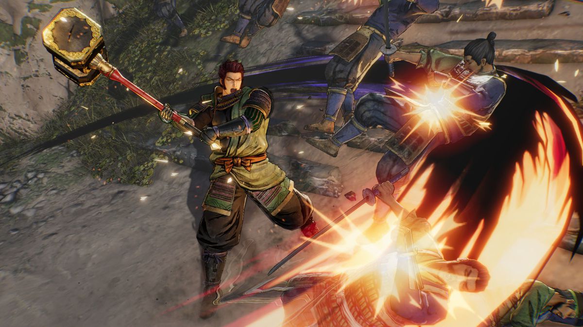 A character in Samurai Warriors 5 sweeps back his enemies with a staff