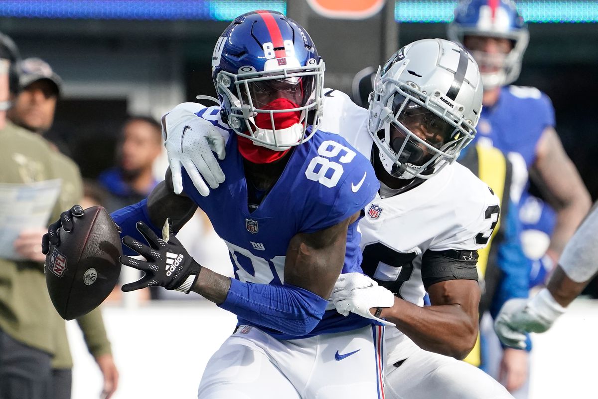 New York Giants wide receiver Kadarius Toney (89) is stopped by Las Vegas Raiders cornerback Nate Hobbs (39) as he attempted a pass in the first half at MetLife Stadium.&nbsp;