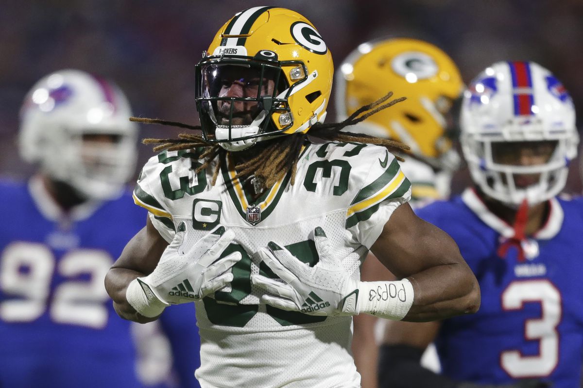 Aaron Jones #33 of the Green Bay Packers celebrates a first-down run during the first half against the Buffalo Bills at Highmark Stadium on October 30, 2022 in Orchard Park, New York.