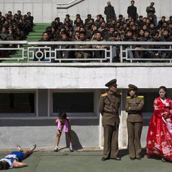 Runners rest inside Kim Il Sung Stadium in Pyongyang, North Korea on Sunday, April 14, 2013. North Korea hosted the 26th Mangyongdae Prize Marathon to mark the upcoming April 15, 2013 birthday of the late leader Kim Il Sung. 