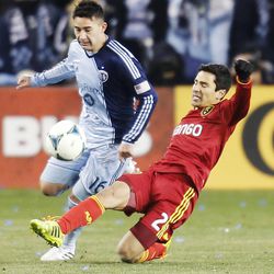 Real's Tony Beltran kicks the ball past Kansas City's Claudio Bieler as Real Salt Lake and Sporting KC play Saturday, Dec. 7, 2013 in MLS Cup action. Sporting KC won in a shootout.