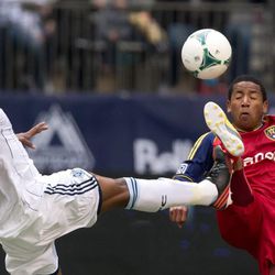 Vancouver Whitecaps' Nigel Reo-Coker, left, of England, and Real Salt Lake's Joao Plata, of Ecuador, battle for the ball during the first half of an MLS soccer game in Vancouver, British Columbia, on Saturday April 13, 2013.
