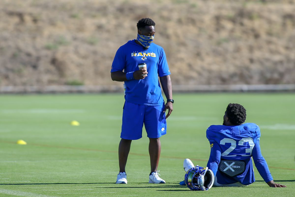 Los Angeles Rams coach Thomas Brown talks with Los Angeles Rams running back Cam Akers #23 during the Los Angeles Rams training camp on August 26, 2020, at Cal Lutheran University in Thousand Oaks, CA.