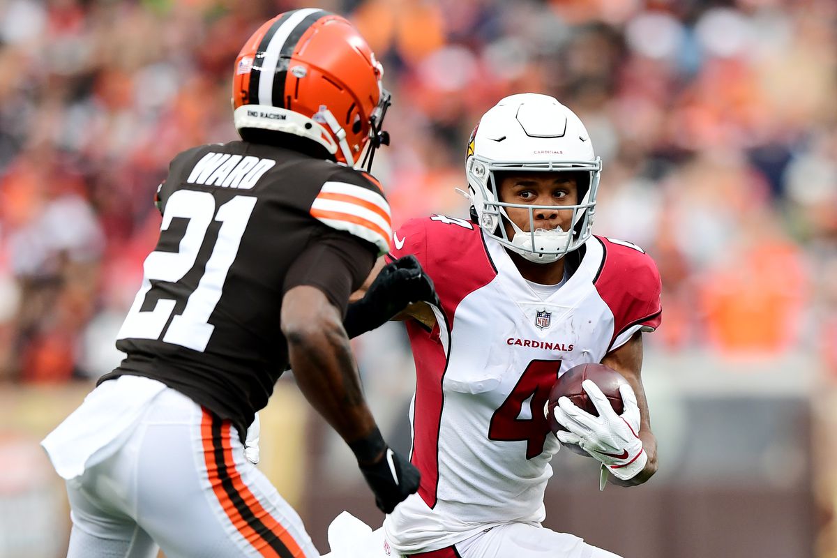 Rondale Moore #4 of the Arizona Cardinals runs the ball against Denzel Ward #21 of the Cleveland Browns during a game at FirstEnergy Stadium on October 17, 2021 in Cleveland, Ohio.