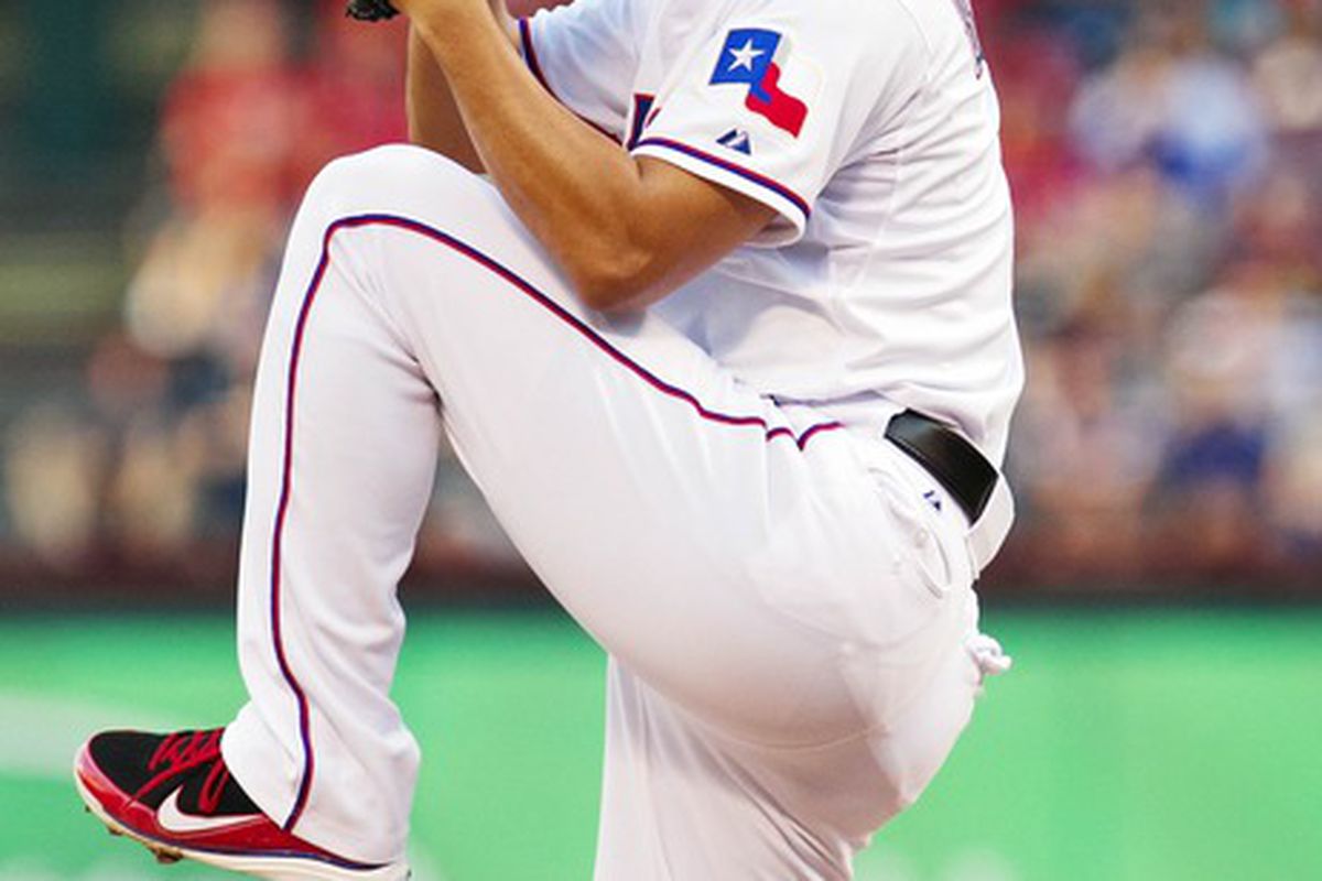 Apr 24, 2012; Arlington, TX, USA; Texas Rangers starting pitcher Yu Darvish (11) pitches during the first inning against the New York Yankees at Rangers Ballpark.  Mandatory Credit: Kevin Jairaj-US PRESSWIRE