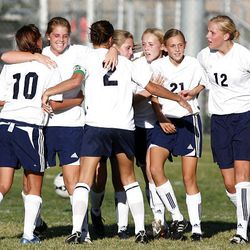 Timpanogos players swarm around teammate Shelby Murray (second from left) after she scored the match's sole goal against Weber.